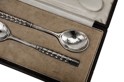 Lot 530 - A cased pair of George VI sterling silver ‘arts and crafts’ spoons, London 1939 by Omar Ramsden