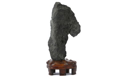 Lot 64 - A CHINESE SCHOLAR’S ROCK. With a black porous...