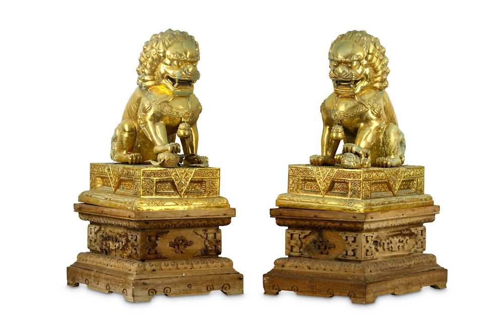 Lot 156 - A PAIR OF LARGE CHINESE GILT-METAL LIONS AND STANDS.