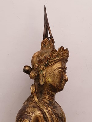 Lot 635 - A GILT-BRONZE FIGURE OF VAJRADHARA.