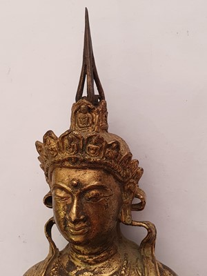 Lot 635 - A GILT-BRONZE FIGURE OF VAJRADHARA.