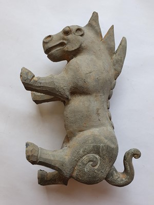 Lot 499 - A CHINESE POTTERY FIGURE OF A MYTHICAL BEAST.