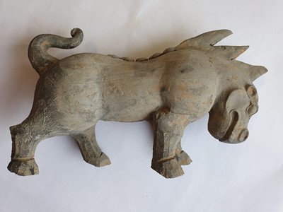 Lot 499 - A CHINESE POTTERY FIGURE OF A MYTHICAL BEAST.
