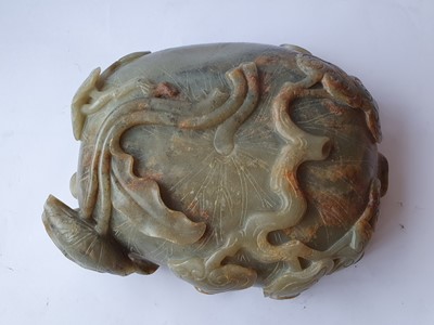 Lot 569 - A CHINESE JADE 'LOTUS' WASHER, A LION DOG CARVING AND A BRUSH POT AND COVER.