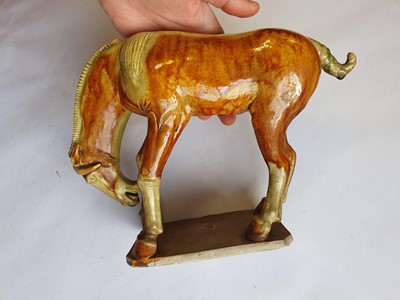 Lot 503 - TWO CHINESE POTTERY FIGURES OF HORSES.