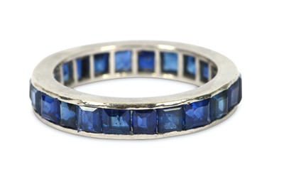 Lot 194 - A sapphire eternity ring, designed as a...