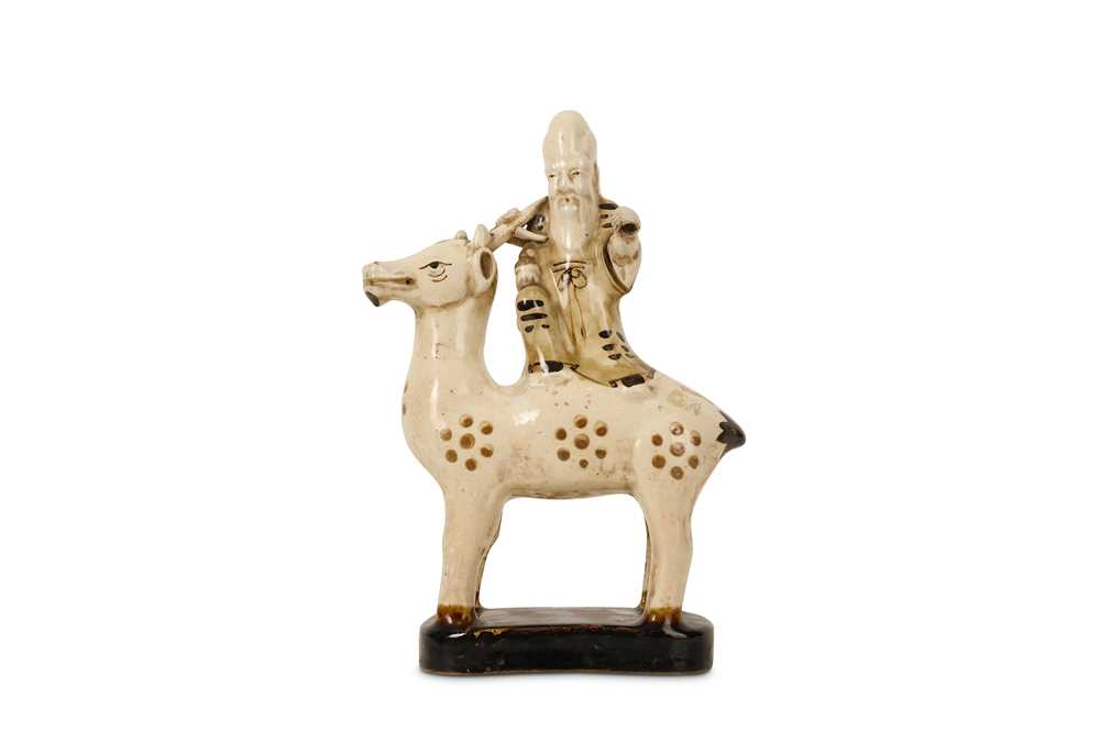 Lot 592 - A CHINESE POTTERY FIGURE OF SHOULAO ON A DEER.