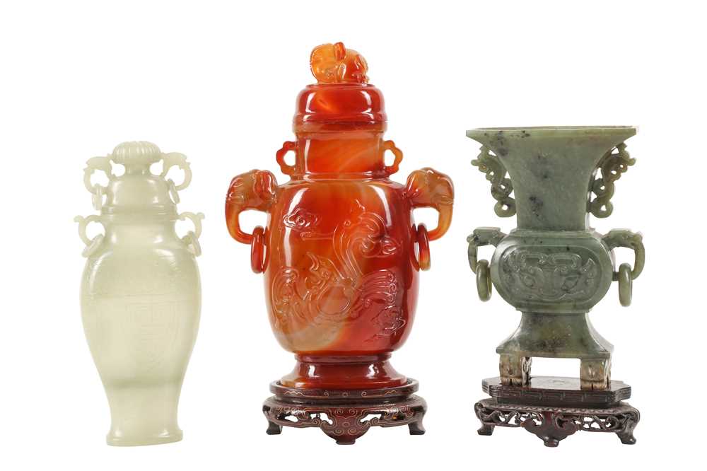 Lot 258 - THREE CHINESE CARVED HARDSTONE VASES.