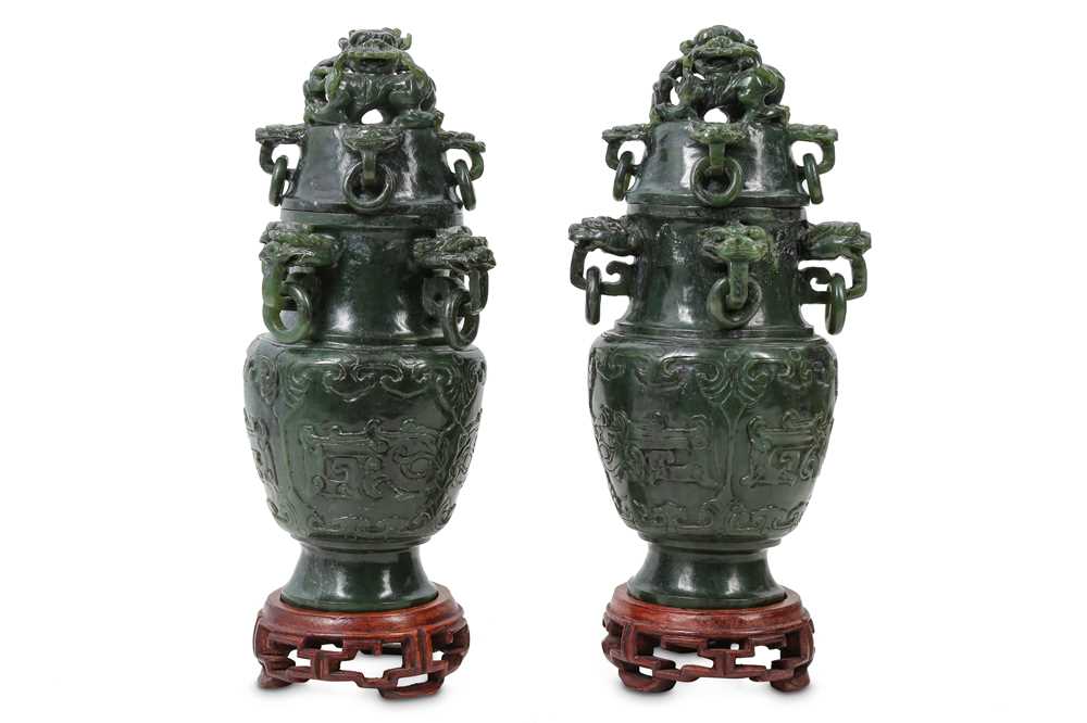 Lot 175 - A PAIR OF CHINESE SPINACH JADE 'DRAGON' VASES AND COVERS.
