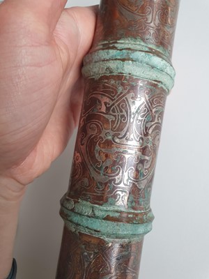 Lot 226 - A CHINESE SILVER-INLAID BRONZE CHARIOT CANOPY FITTING.