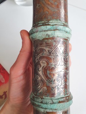 Lot 350 - A CHINESE SILVER-INLAID BRONZE CHARIOT CANOPY FITTING.
