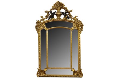 Lot 407 - A gilt framed wall mirror, the central rounded...