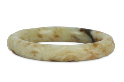 Lot 295 - A CHINESE PALE CELADON JADE BANGLE. Carved...