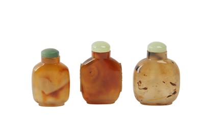 Lot 708 - THREE CHINESE AGATE SNUFF BOTTLES.