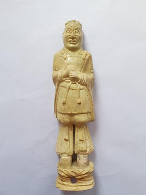 Lot 233 - A RARE CHINESE STRAW GLAZED FIGURE OF AN OFFICIAL.