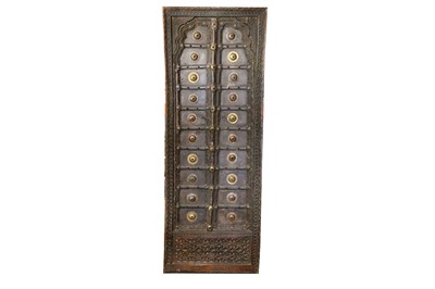Lot 219 - A WOODEN DOOR WITH BRASS FITTINGS Possibly...