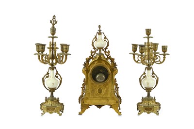 Lot 98 - A French gilt metal clock garniture with...