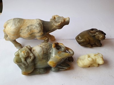 Lot 695 - FOUR CHINESE HARDSTONE 'BUFFALO' CARVINGS.
