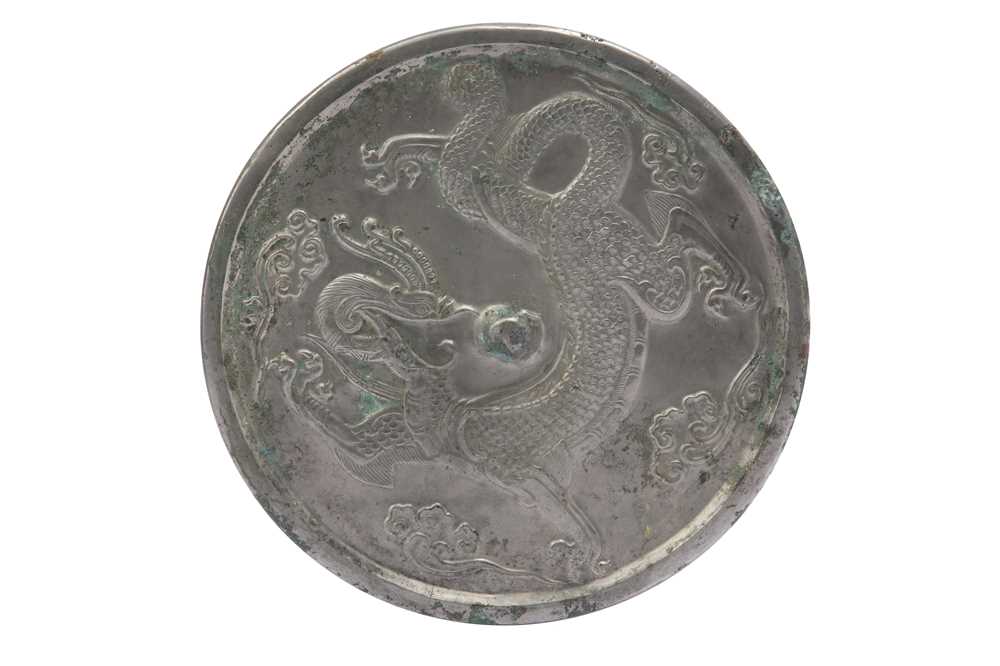 Lot 995 - A CHINESE BRONZE MIRROR.