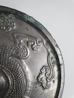 Lot 995 - A CHINESE BRONZE MIRROR.