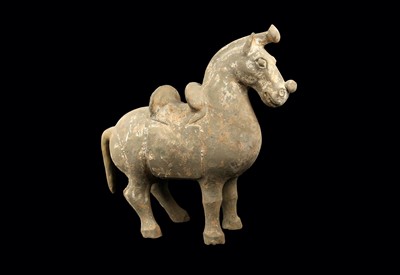Lot 330 - A CHINESE POTTERY MODEL OF A SADDLED HORSE