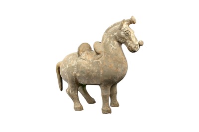 Lot 157 - A CHINESE POTTERY MODEL OF A SADDLED HORSE