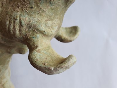 Lot 38 - A CHINESE GREEN-GLAZED MODEL OF A DOG.