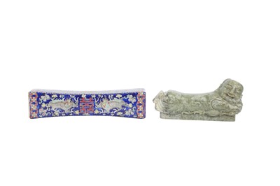 Lot 700 - A CHINESE GREEN JADE 'BOY' PILLOW AND A FAMILLE ROSE PILLOW.