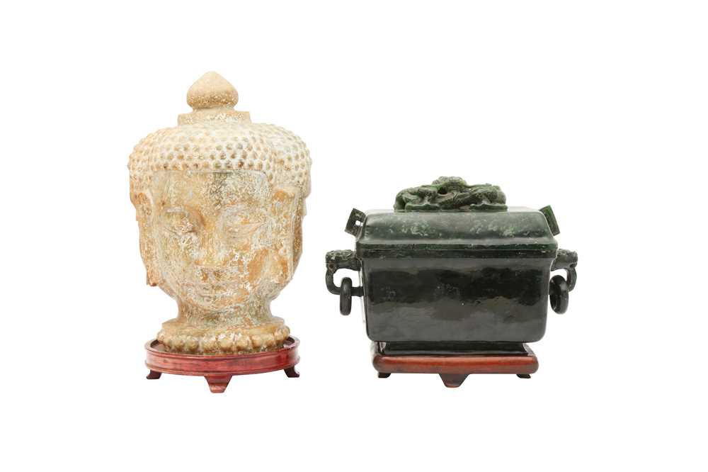 Lot 519 - A CHINESE SPINACH-GREEN JADE BOX AND COVER AND A CELADON JADE BUDDHA HEAD.