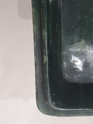 Lot 519 - A CHINESE SPINACH-GREEN JADE BOX AND COVER AND A CELADON JADE BUDDHA HEAD.