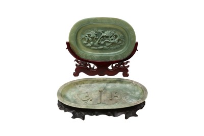 Lot 512 - TWO CHINESE PALE CELADON JADE OVAL DISHES.