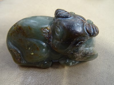 Lot 494 - THREE CHINESE PALE CELADON JADE 'OX' CARVINGS.