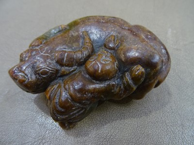 Lot 494 - THREE CHINESE PALE CELADON JADE 'OX' CARVINGS.