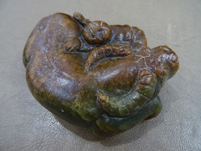 Lot 494 - THREE CHINESE PALE CELADON JADE 'OX' CARVINGS.
