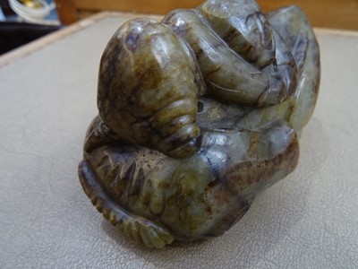 Lot 494 - THREE CHINESE PALE CELADON JADE 'OX' CARVINGS.