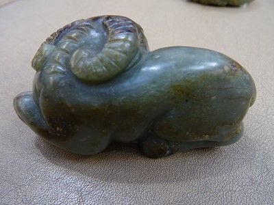 Lot 494 - THREE CHINESE PALE CELADON JADE 'OX' CARVINGS.