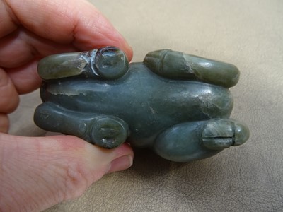 Lot 494 - THREE CHINESE PALE CELADON JADE 'OX' CARVINGS.