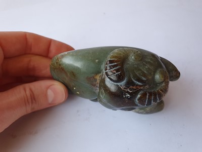Lot 407 - THREE CHINESE PALE CELADON JADE 'OX' CARVINGS.