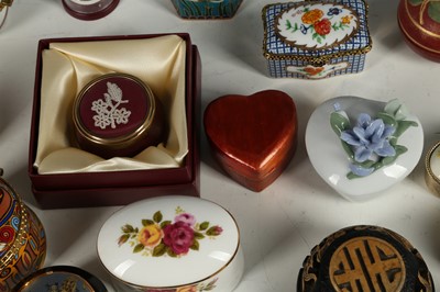 Lot 147 - A quantity of porcelain trinket boxes many by...