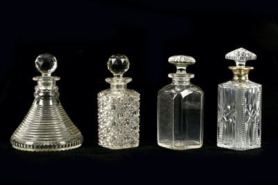 Lot 299 - A collection of four glass decanters,...