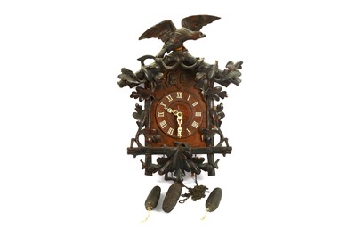 Lot 527 - A 19th Century black forest cuckoo clock,...