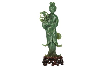 Lot 101 - A CHINESE GREEN JADE FIGURE OF AN IMMORTAL...