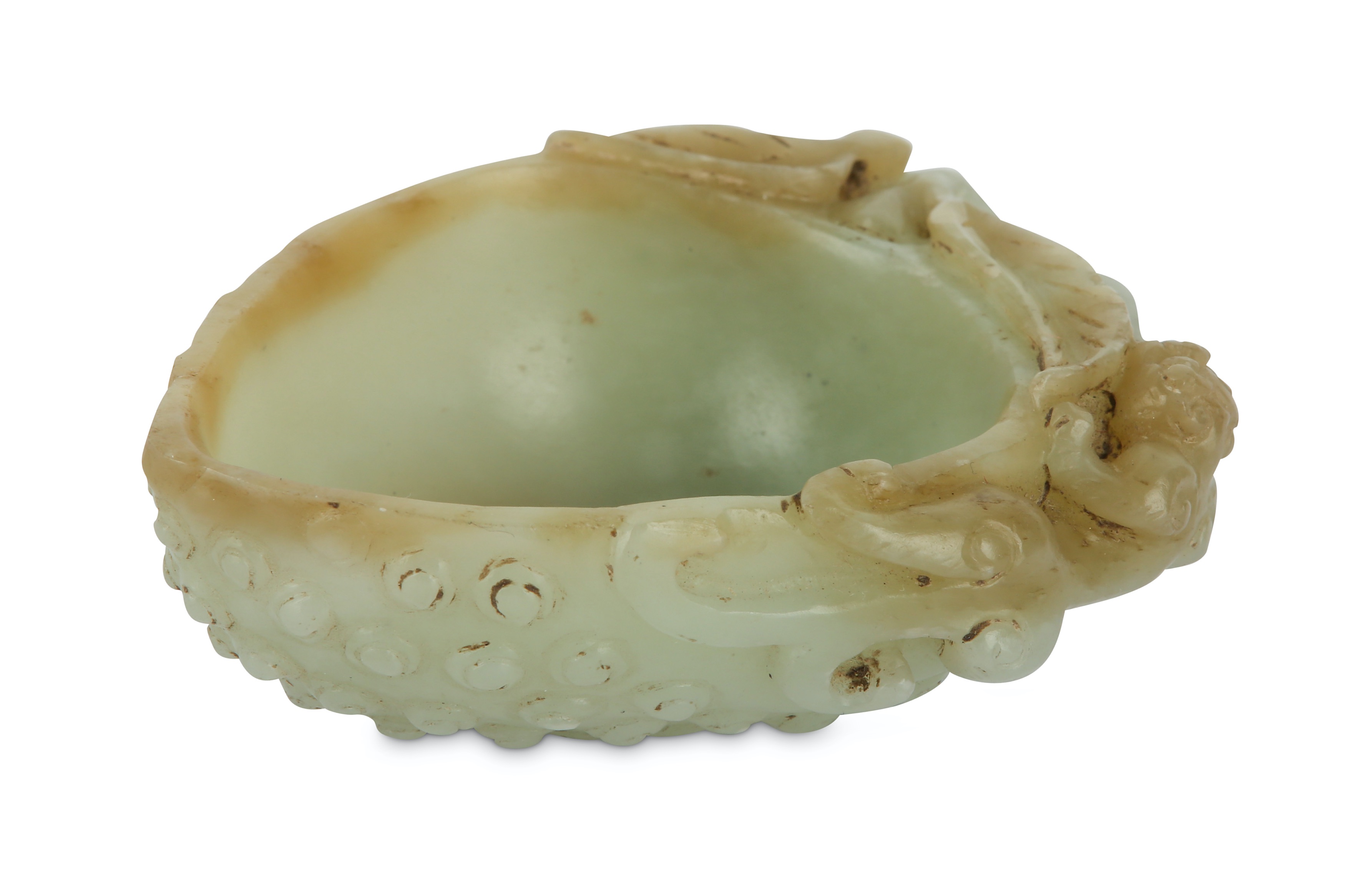 Lot 523 A CHINESE PALE CELADON JADE ‘FRUIT' CUP.