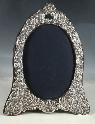 Lot 148 - A hallmarked silver repoussé photo frame.