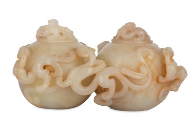 Lot 296 - A Chinese cream jade twin 'Chilong' box and covers.