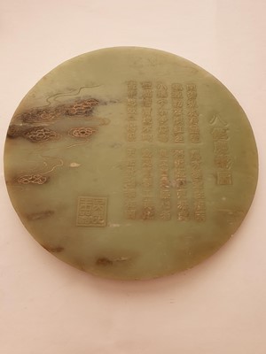 Lot 126 - A CHINESE PALE CELADON JADE CIRCULAR 'IMMORTALS' TABLE SCREEN.