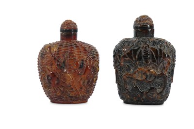 Lot 524 - TWO CHINESE AMBER SNUFF BOTTLES.
