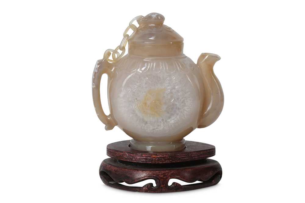 Lot 657 - A CHINESE AGATE TEAPOT AND COVER.