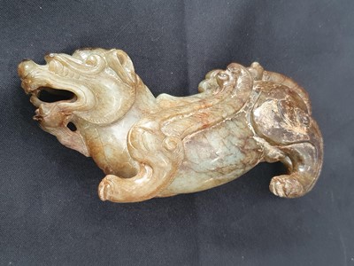 Lot 174 - TWO CHINESE JADE CARVINGS OF LIONS.