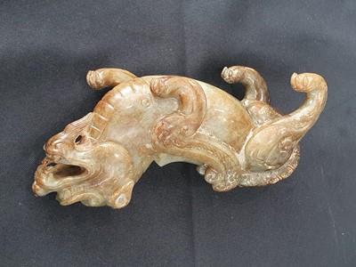Lot 174 - TWO CHINESE JADE CARVINGS OF LIONS.